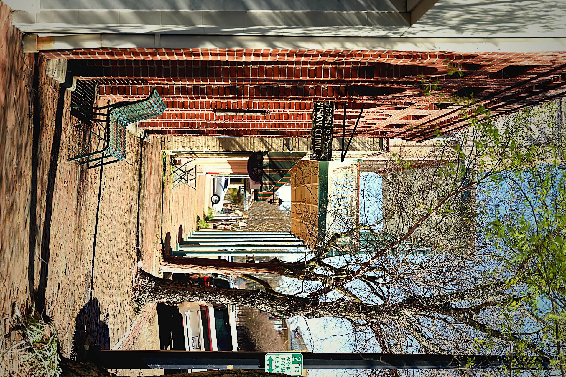 Brick sidewalk with awnings in Natchez