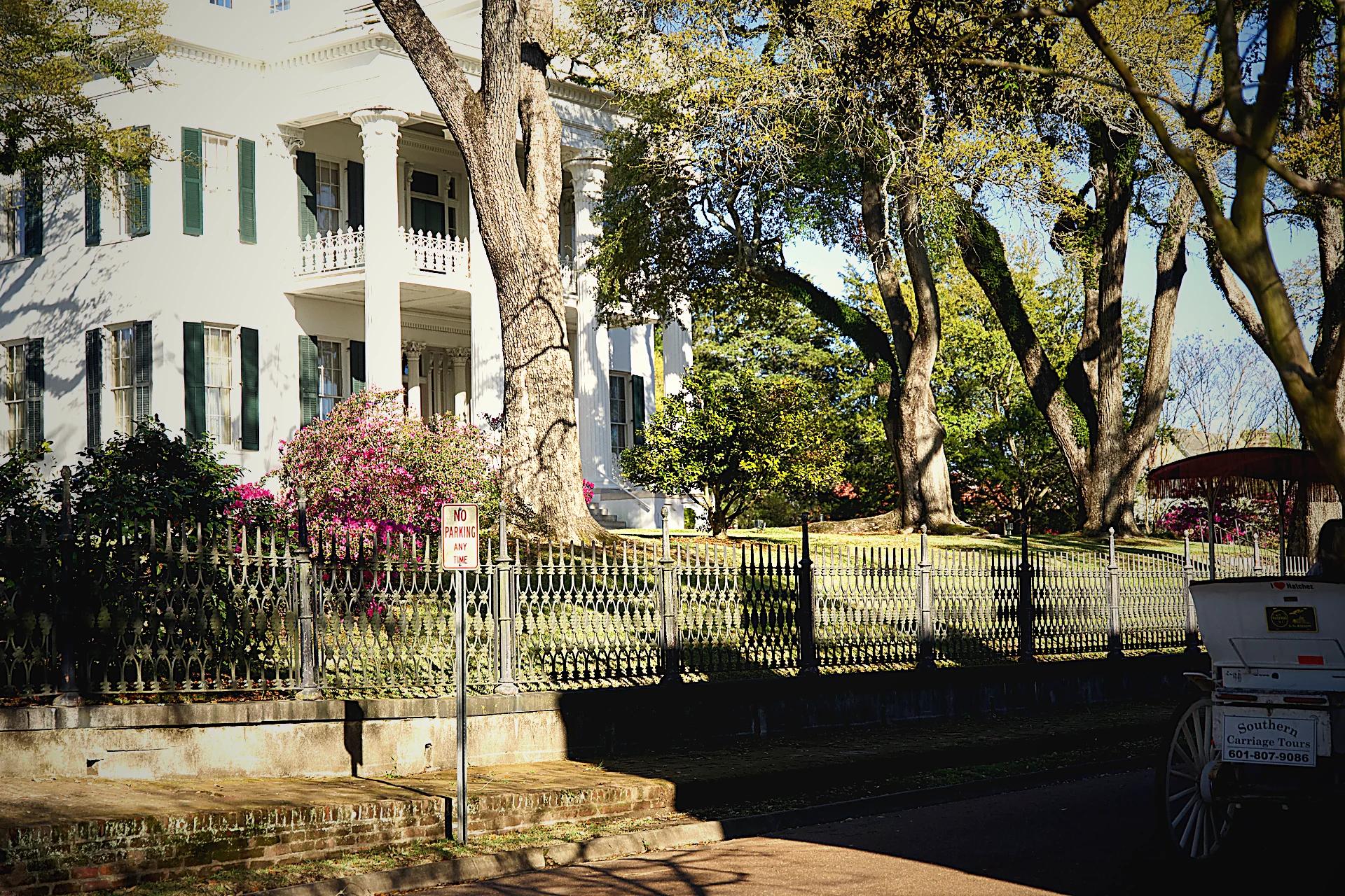 Antebellum mansion with iron fence
